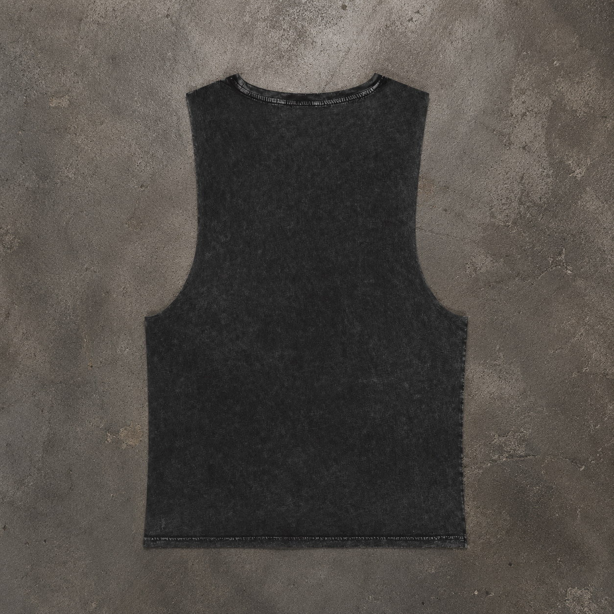 Plain back shot o MCC Stonewashed Tank Layed flat on a concrete floor 